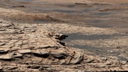 This photo, compiled from 28 images, shows the view from NASA’s Curiosity Mars rover on April 9, 2020. It shows the landscape of the Stimson sandstone formation in Gale Crater. (Photo Credit: NASA/JPL-Caltech/MSSS)