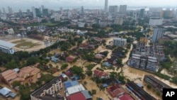 An aerial view shows the flooded George Town city in Penang, Malaysia, Nov. 5, 2017. A northern Malaysian state has been paralyzed by a severe storm that led to two deaths and some 2,000 people evacuated in the worst flooding in years, officials say. 