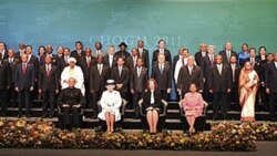 Britain's Queen Elizabeth II, sitting second left, is joined by Commonwealth Secretary-General