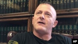 FILE - Richard Ojeda talks at his campaign headquarters in Logan, W.Va., May 15, 2018. The retired Army paratrooper is ending his 2020 presidential bid.