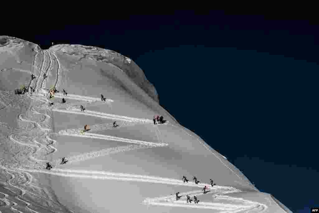 Skiers compete during the first stage of the 33rd edition of the Pierra Menta ski mountaineering competition in Areches-Beaufort, France.