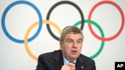 FILE - International Olympic Committee President Thomas Bach is seen speaking during a press conference at IOC headquarters in Lausanne, Switzerland, July 9, 2014.