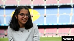 FILE - Syrian refugee Nujeen Mustafa poses after a charity Christmas event, "Nujeen's Dream," at Camp Nou stadium in Barcelona, Spain, Dec. 14, 2017.
