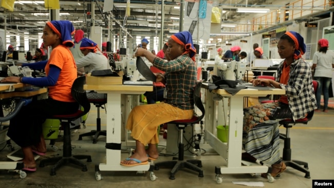 FILE - Workers sew clothes inside the Indochine Apparel textile factory in Hawassa Industrial Park in Southern Nations, Nationalities and Peoples region, Ethiopia November 17, 2017. (REUTERS/Tiksa Negeri/File Photo)
