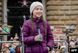 Swedish climate activist Greta Thunberg speaks on stage during a demonstration of students calling for climate protection on March 1, 2019, in front of the city hall in Hamburg, Germany.