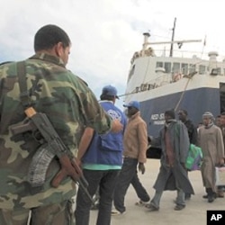 Migrant workers from Africa arrive by ship from Misrata during an evacuation operation organized by the International Organization for Migration (IOM) at the port of Benghazi May 5, 2011.