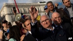 Antonio Ledezma, former mayor of Caracas, waves to supporters of Venezuelan opposition leader Juan Guaido during a gathering in Madrid, Spain, April 30, 2019. Thousands of Venezuelans have migrated to Spain in recent years.