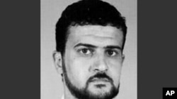 FILE - This image from the FBI website shows Anas al-Libi, an al-Qaida leader connected to the 1998 embassy bombings in eastern Africa and wanted by the United States for more than a decade.