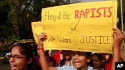 FILE - Indian students hold a protest organized to create awareness of gender-based violence against women in Mumbai, Dec 10, 2014. (AP Photo/Rafiq Maqbool)