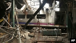 FILE - This photo provided by the National Transportation Safety Board on Oct. 1, 2016, shows damage done to the Hoboken Terminal in Hoboken, N.J., after a commuter train crash. 