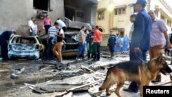Egyptian security personnel and residents check the site of an explosion in Ismailia city, around 120 km, east of Cairo, Oct. 19, 2013. 