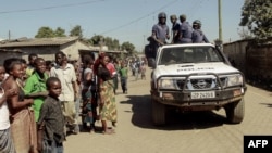 FILE - Zambian police patrol near the Chawama Compound in Lusaka, where residents had attacked and looted foreign-run shops, April 19, 2016. Political campaigning in Lusaka was suspended because of violent clashes ahead of next month’s national elections.