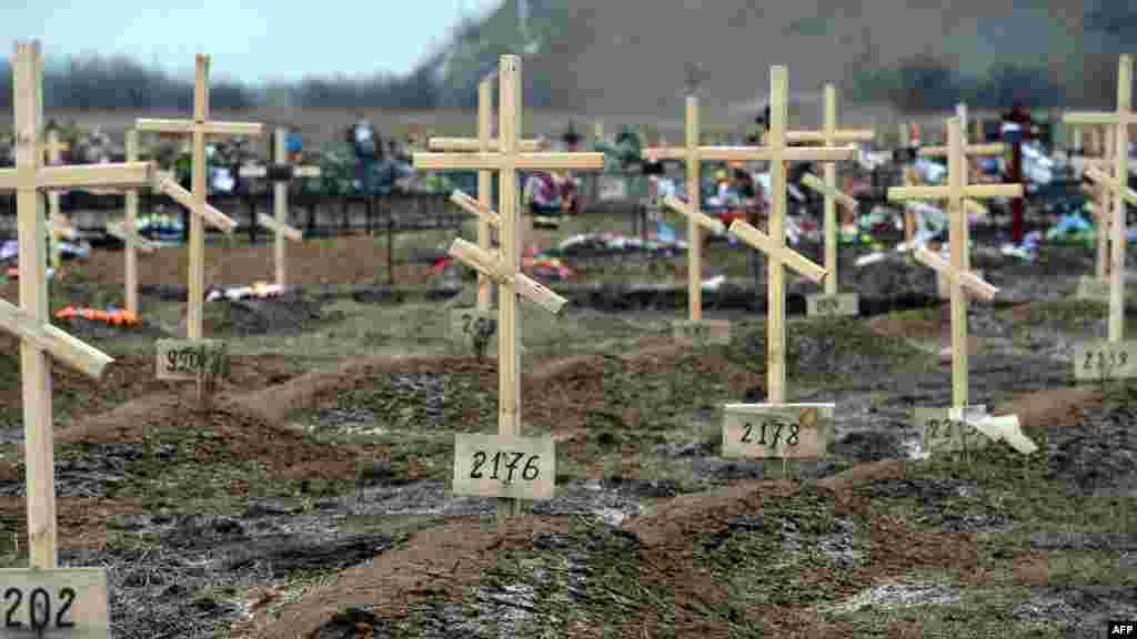 Crosses marked only with numbers stand on the graves of unknown pro-Russian separatists at a cemetery in Donetsk, eastern Ukraine, Feb. 16, 2015. 