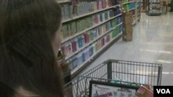 Laura Harders says using coupons can cut her grocery bill in half. (A. Greenbaum/VOA) 