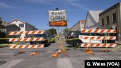 There are road blocks throughout downtown Austin, Texas, during the South by Southwest festival so pedestrians can freely and safely move from venue to venue protected from traffic.