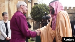 Britain's Archbishop of Canterbury Justin Welby greets the Crown Prince of Saudi Arabia Mohammed bin Salman as he arrives at Lambeth Palace, London, March 8, 2018.