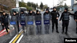 Turkish police stand guard on a road leading to the Reina nightclub by the Bosphorus, which was attacked by a gunman, in Istanbul, Jan. 1, 2017. 