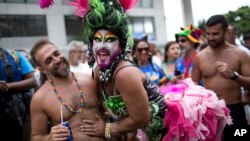 Revelers in costume participate in the Banda de Ipanema carnival "bloco" parade in Rio de Janeiro, Brazil, Jan. 27, 2018. Rio's health authorities are urging Carnival visitors to stick to celebrations in the city and avoid sightseeing at waterfalls and forests where yellow fever has been detected.