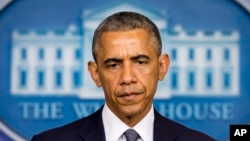 President Barack Obama listens to a question as he spoke about the situation in Ukraine in the Brady Press Briefing Room of the White House, July 18, 2014. 