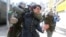 A demonstrator is detained during a rally to demand changes in the education system in Santiago, Chile.
