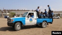 Members of a Yemeni coast guard force ride on the back of a petrol truck during their deployment as part of a U.N.-sponsored peace agreement signed in Sweden earlier this month, at the Red Sea city of Hodeidah, Yemen December 29, 2018. 