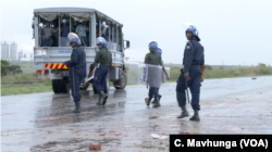 Police are seen deployed in Harare, Jan. 14, 2019, after protesters started blocking roads.