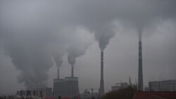 FILE PHOTO - In this photo taken on Nov. 19, 2015, smoke belches from a coal-fueled power station near Datong, in China's northern Shanxi province.