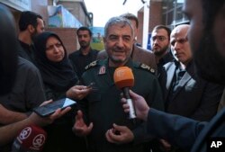 The head of Iran's paramilitary Revolutionary Guard Gen. Mohammad Ali Jafari speaks with journalists after he addressed a conference called "A World Without Terror," in Tehran, Iran, Oct. 31, 2017.