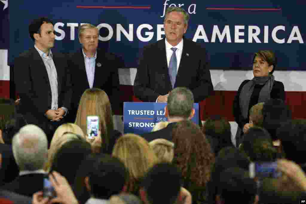 Republican presidential candidate, former Florida Gov. Jeb Bush accompanied by his wife, Columba, son Jeb Bush Jr., left, and Sen. Lindsey Graham, R-S.C., speaks in Columbia, S.C., Feb. 20, 2016. 