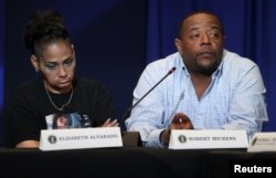 Elizabeth Alvarado and Robert Mickens, whose daughter Nisa Mickens was allegedly killed by MS-13 gang members, participate in a round-table on immigration and the gang MS-13 attended by U.S. President Donald Trump at the Morrelly Homeland Security Center in Bethpage, N.Y., May 23, 2018.