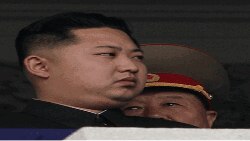노동당 창건기념행사에서 측근 장성으로부터 설명을 듣는 김정은