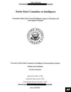 FILE - A copy of the cover of the CIA torture report released by Senate Intelligence Committee Chair Sen. Dianne Feinstein D-Calif., Dec. 9, 2014.