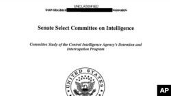 FILE - A copy of the cover of the CIA torture report released by Senate Intelligence Committee Chair Sen. Dianne Feinstein D-Calif., Dec. 9, 2014. 
