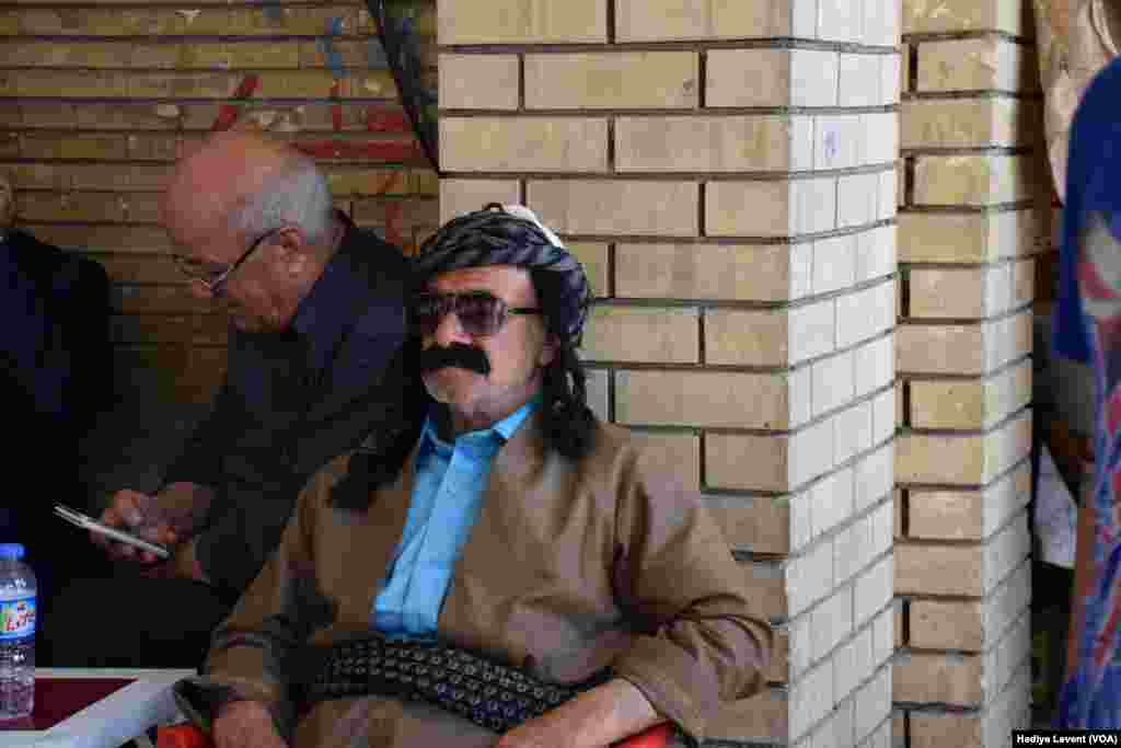 A resident enjoys tea in one of the small teahouses in the souq in Irbil, Iraq.