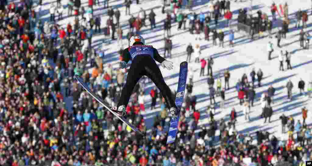 Austria's Thomas Diethart soars during his trial jump at the second stage of the four hills ski jumping tournament in Garmisch-Partenkirchen, southern Germany.
