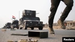 Konvoi pasukan khusus Irak terus bergerak maju menuju kota Mosul, Rabu (25/10). 