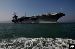 FILE - The aircraft carrier USS Carl Vinson is anchored in Hong Kong waters.