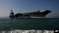 FILE - The aircraft carrier USS Carl Vinson is shown off Hong Kong, Dec. 27, 2011.