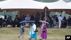 Families of Germanwings victims gather during an homage ceremony in front of a stele in Le Vernet, French Alps, July 24, 2015. 