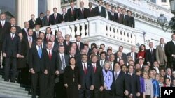 New members of the 112th U.S. Congress pose for a freshman group photo on the East Front steps of the U.S. House of Representatives on Capitol Hill, 4 Jan. 2011
