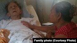 Huỳnh Thị Chút (right) takes care of Gary Wittig who was bedridden after a fall triggered a heart attack. They reunited in Atlanta, Georgia, 48 years after they first met in Đà Nẵng during the height of Vietnam War.