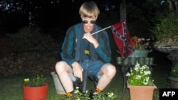 This undated photo taken from Lastrhodesian.com allegedly shows Dylann Roof. The website, which surfaced after the murder of nine parishoners at an African American Church in Charleston, SC, also included a white supremacist manifesto.