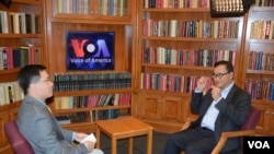 VOA Khmer Service broadcaster Kimseng Men (left) interviews Cambodian opposition leader Sam Rainsy