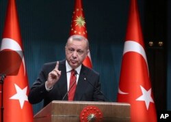 Turkey's President Recep Tayyip Erdogan speaks during a ceremony at the presidential palace, in Ankara, Turkey, May 6, 2019.