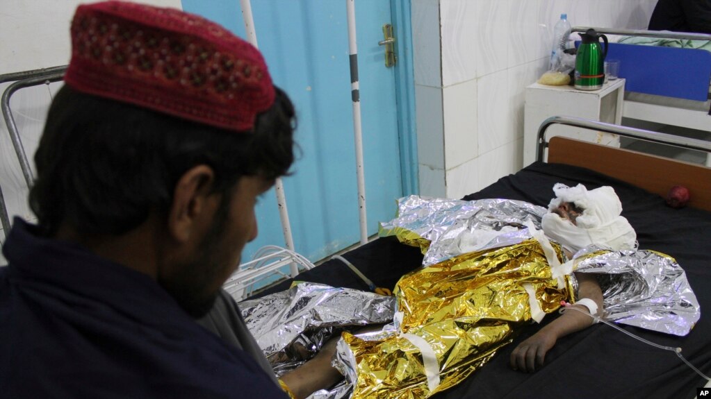 An injured boy receives treatment at a hospital after an airstrike in Helmand province, southern Afghanistan, Nov. 28, 2018. 