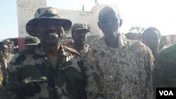 (Left to Right) Puntland Planning Minster Shire Haji Farah and Yusuf Mohamed Dhedo, Governor of Bari region standing outside the Headquarters of the District Commissioner in Qandala on Dec. 7, 2016. (Photo: Fadumo Yasin Jama / VOA)