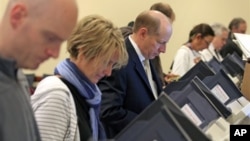 Voters at their voting machines at the Utah State Capitol Tuesday, Nov. 6, 2012, in Salt Lake City. 