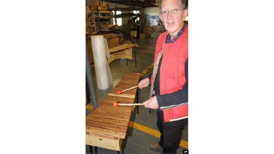 Andrew Tracey with a xylophone inside the AMI factory in South Africa, one of the few remaining manufacturers of traditional African instruments