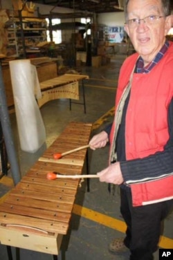Andrew Tracey with a xylophone inside the AMI factory in South Africa, one of the few remaining manufacturers of traditional African instruments