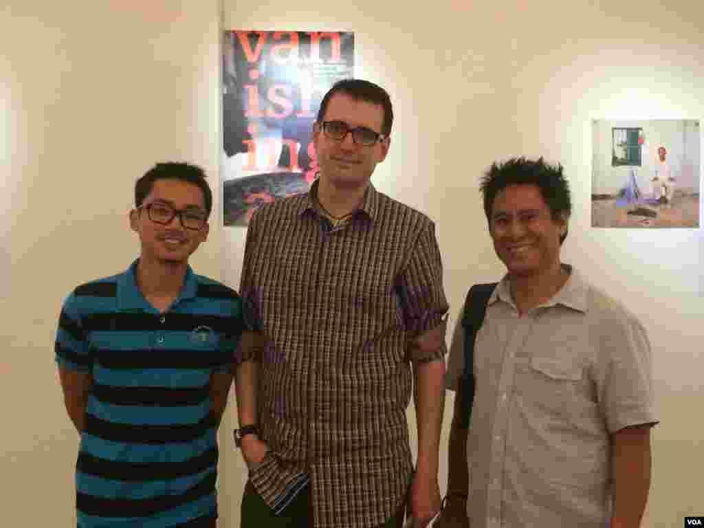 Author Ryun Patterson and photographer Rick Valenzuela posed with a Cambodian student who helped with the translation of the &lsquo;Vanishing Act&rsquo;.